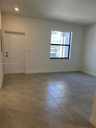 a bathroom with a shower and a window
