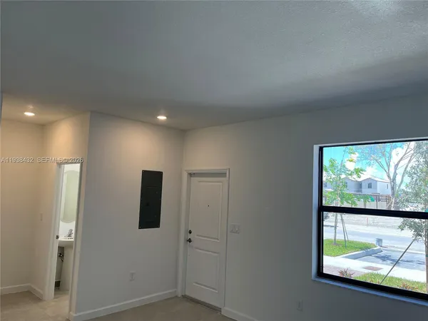 a view of a livingroom with wooden floor