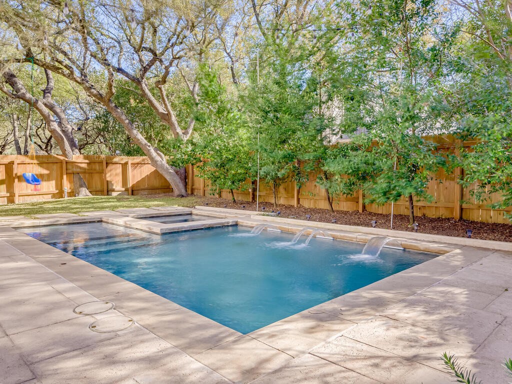 a view of swimming pool with trees