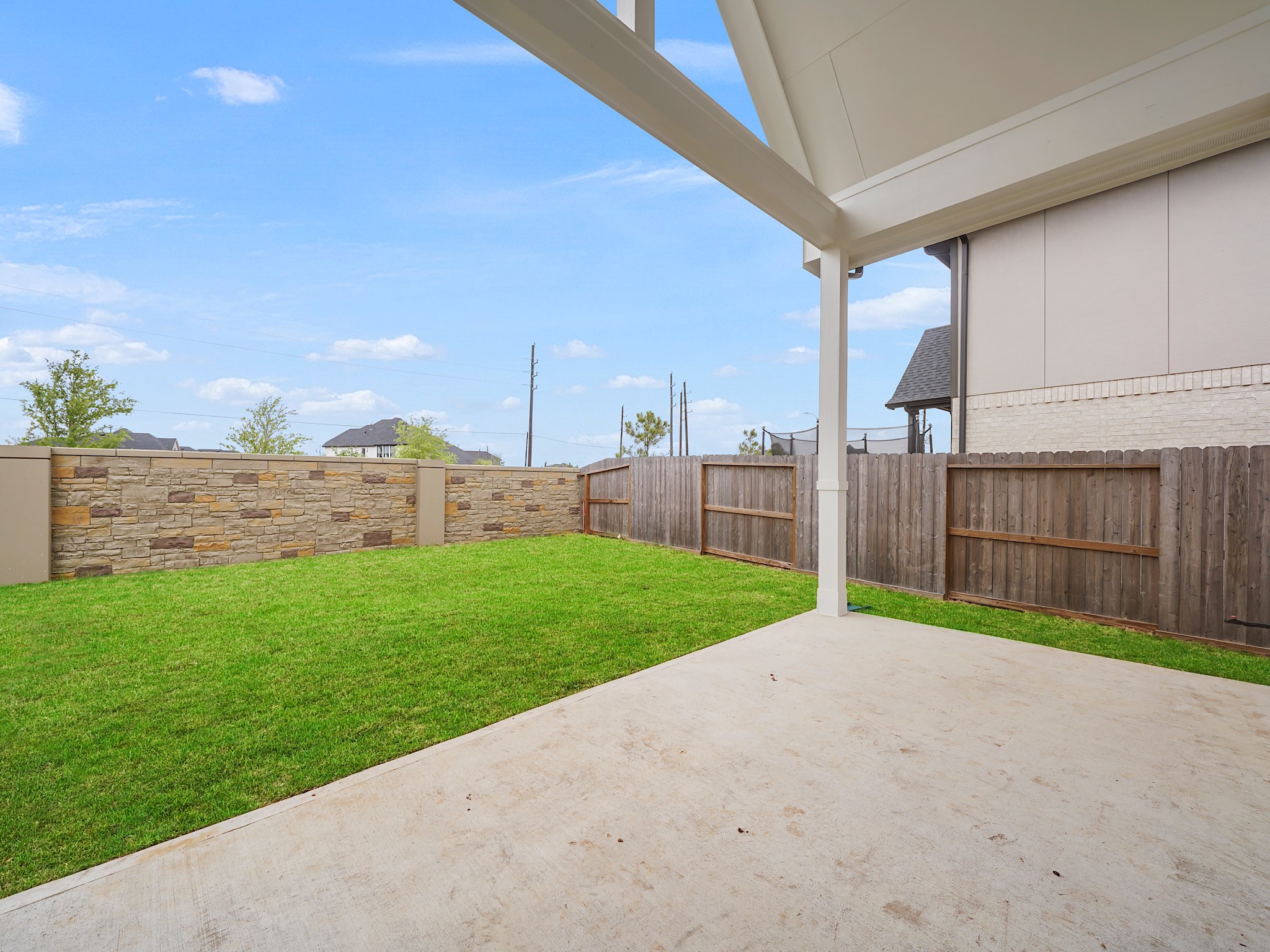 6010 Rolling Strm Court Fulshear, TX 77441 - Photo 22 of 23 magine yourself unwinding after a long day on this property's amazing covered back porch. Offering protection from the elements, it's the ideal space for al fresco dining, enjoying your morning coffee, or simply relaxing in the tranquility of your backyard.