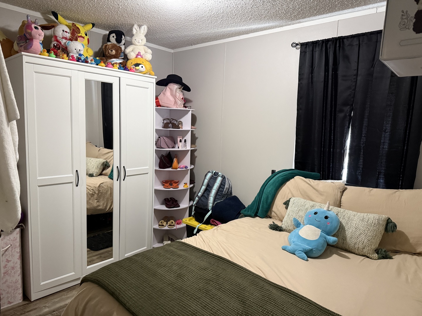 38455 North Sheridan Road, Unit 768 Beach Park, IL 60087 - Photo 12 of 15 a bedroom with a bed and cabinets