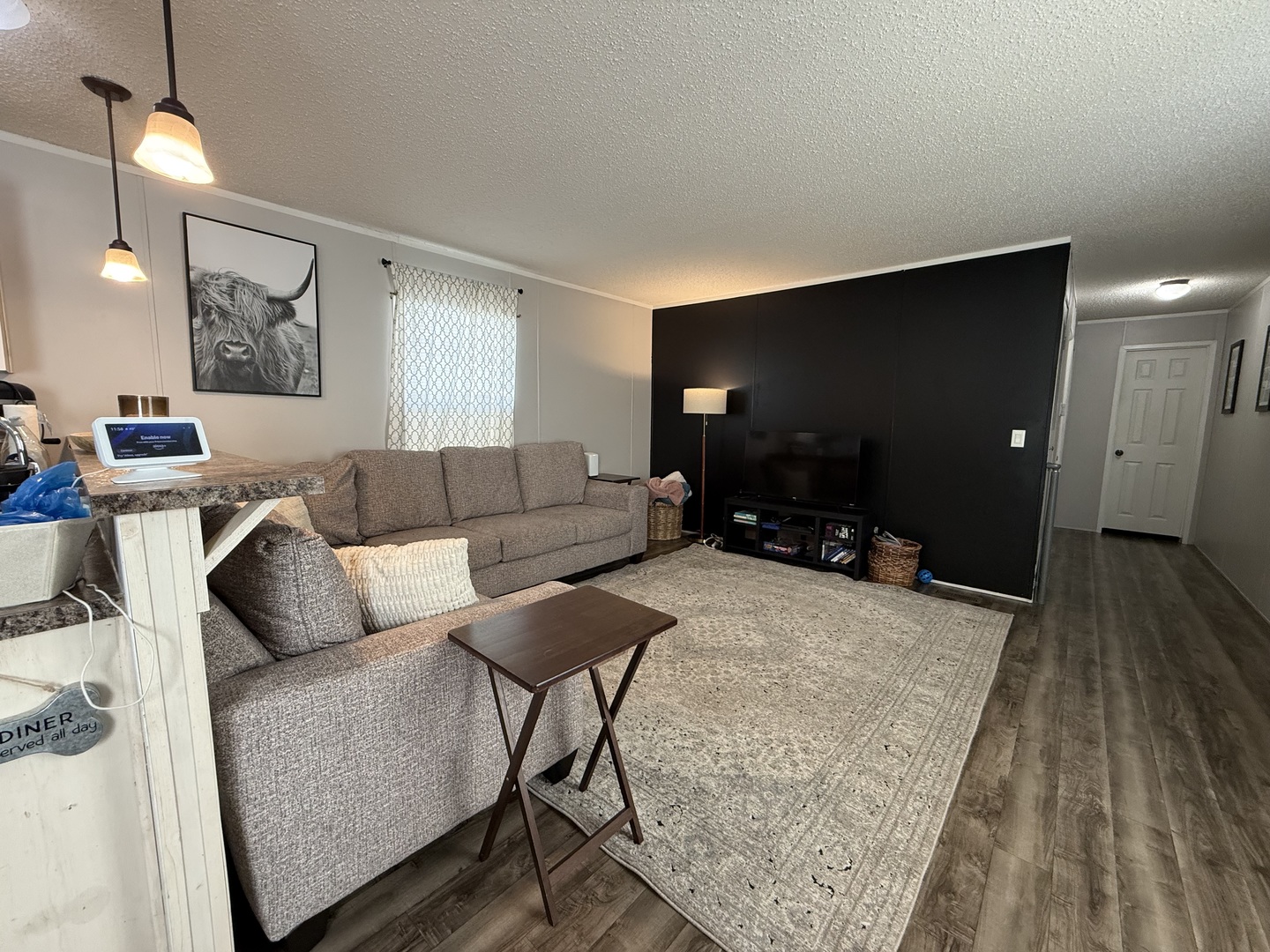 38455 North Sheridan Road, Unit 768 Beach Park, IL 60087 - Photo 2 of 15 a living room with furniture and a flat screen tv