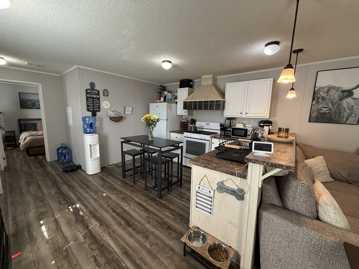 38455 North Sheridan Road, Unit 768 Beach Park, IL 60087 - Photo 5 of 15 a living room with furniture a table and kitchen view