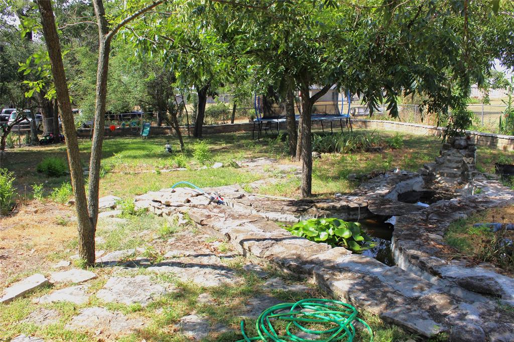 312 Magnolia Street Hico, TX 76457 - Photo 16 of 16 a view of a garden with a tree