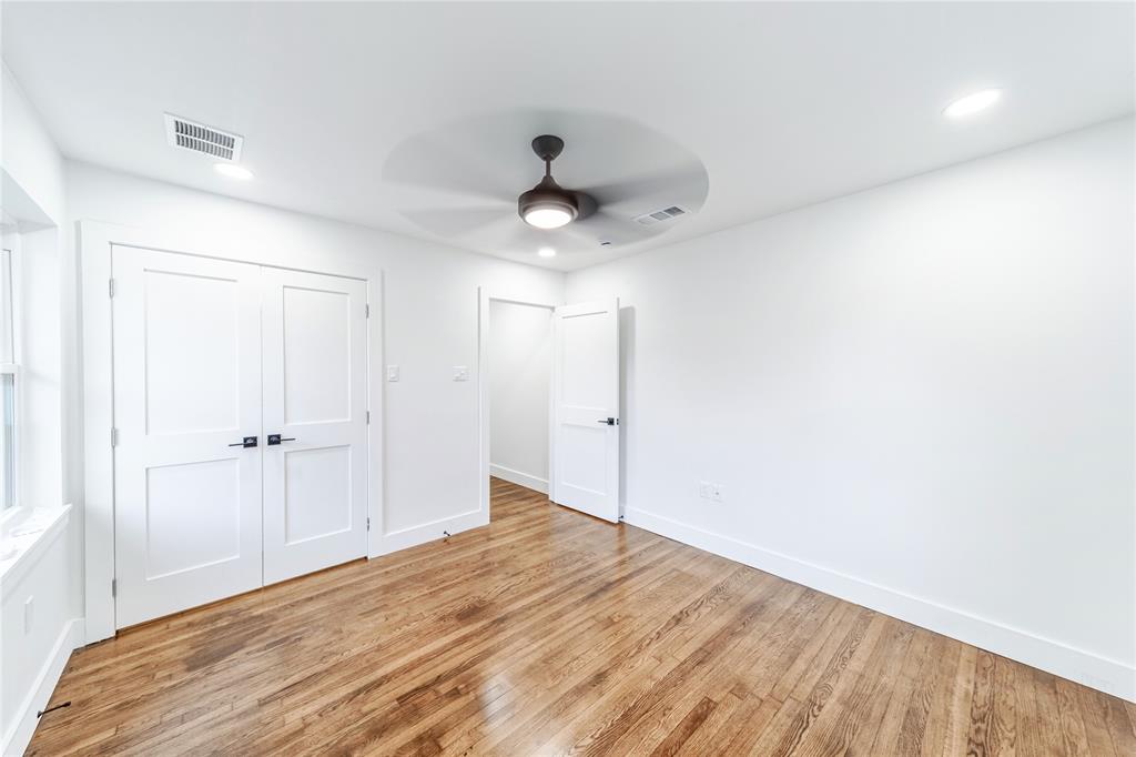 932 Treasure Road Garland, TX 75041 - Photo 19 of 23 a view of a room with a ceiling fan
