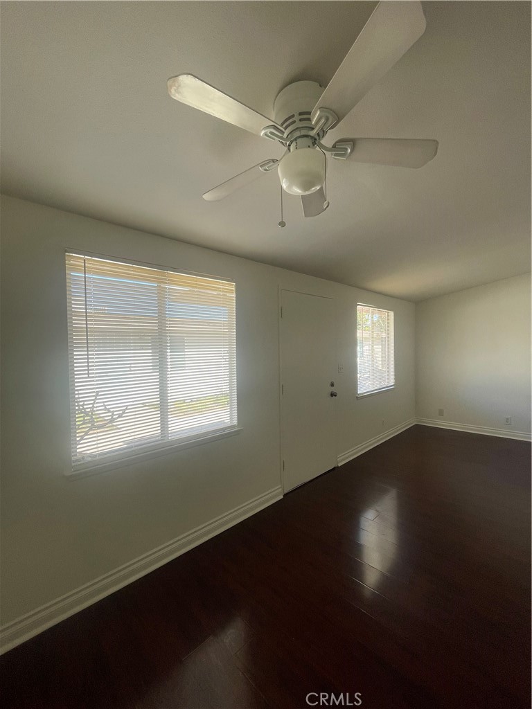 528 Cherry, Unit B Long Beach, CA 90802 - Photo 3 of 16 a view of an empty room with wooden floor and a window