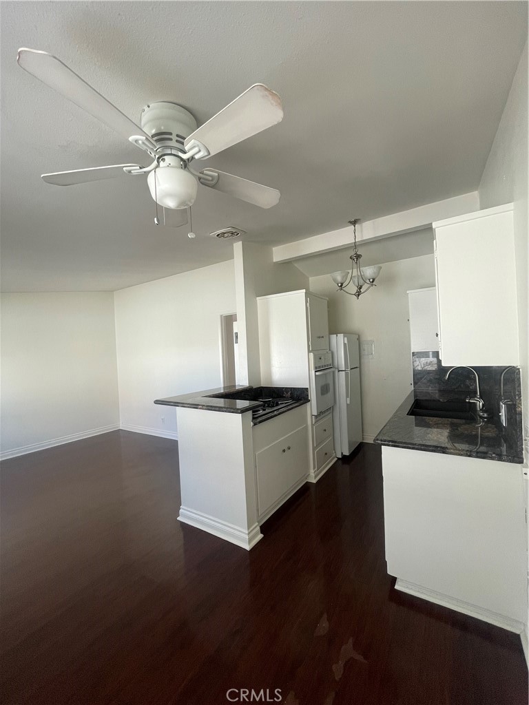 528 Cherry, Unit B Long Beach, CA 90802 - Photo 7 of 16 a kitchen with stainless steel appliances a sink and a refrigerator
