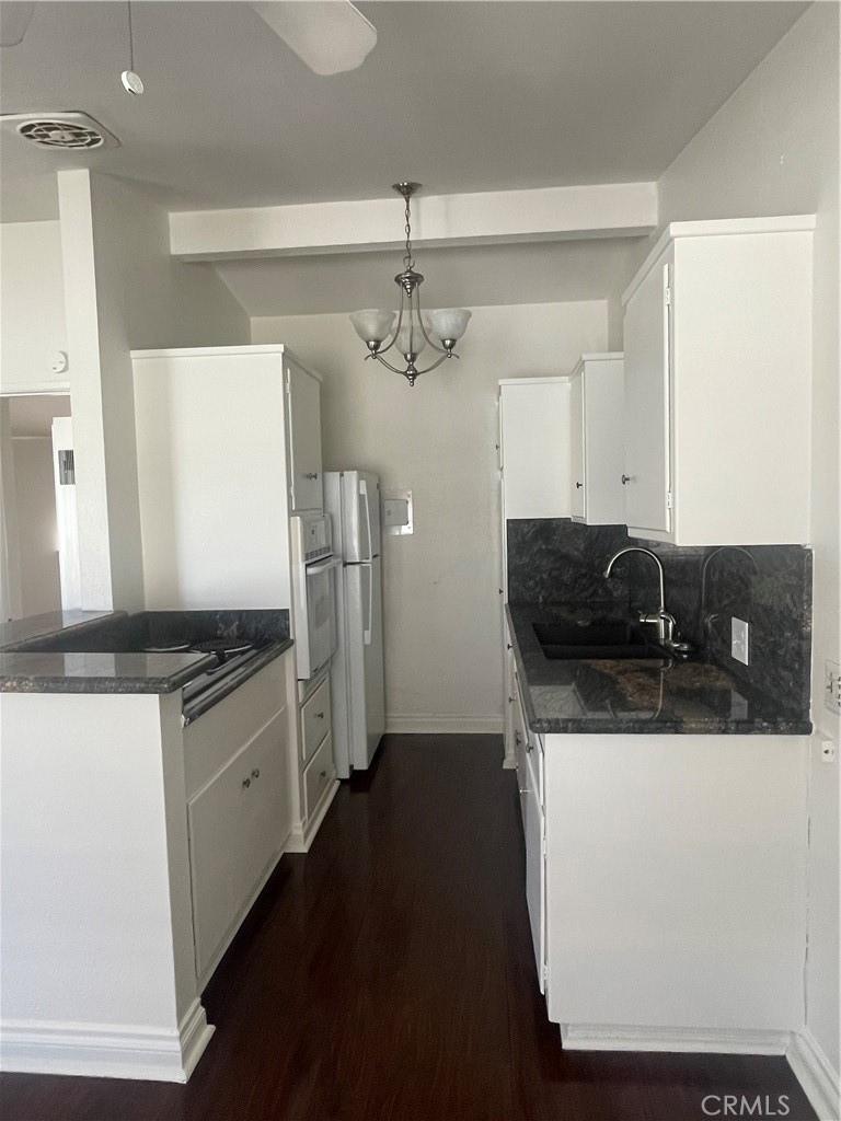 528 Cherry, Unit B Long Beach, CA 90802 - Photo 9 of 16 a kitchen with stainless steel appliances granite countertop a sink and a refrigerator