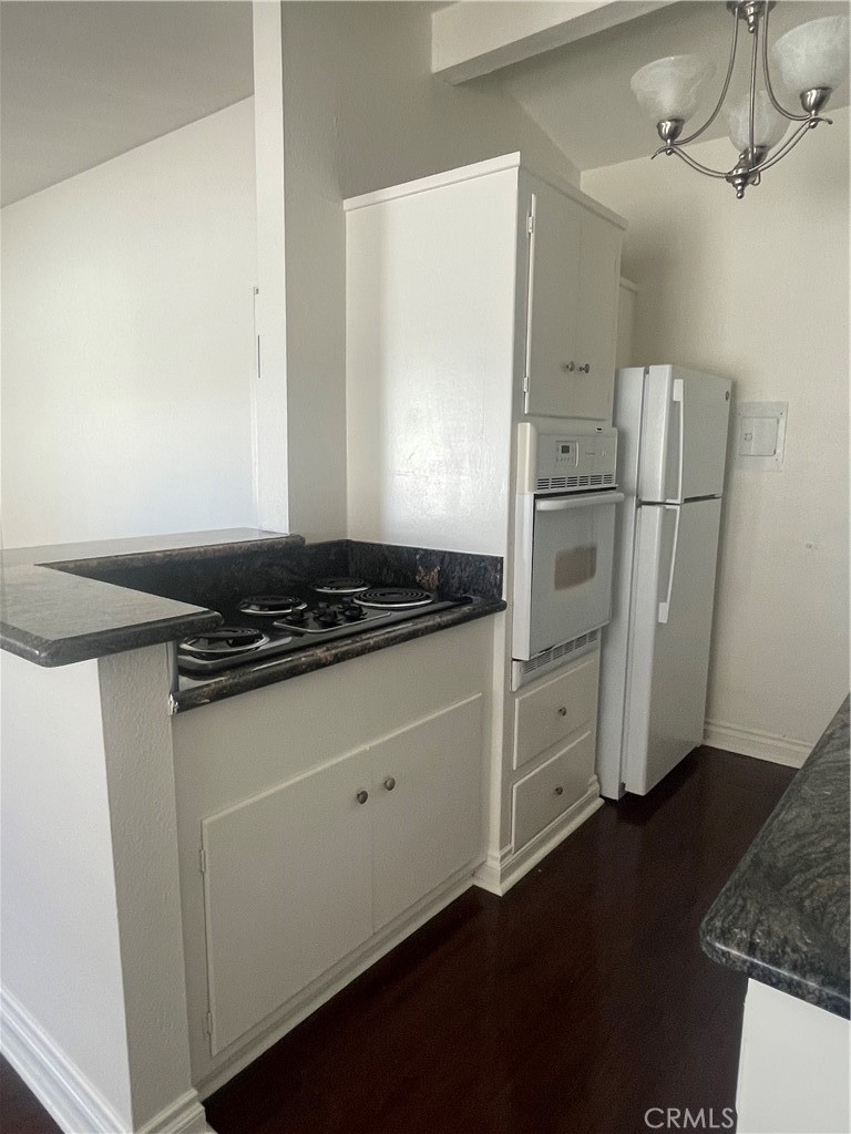 528 Cherry, Unit B Long Beach, CA 90802 - Photo 10 of 16 a kitchen with a refrigerator and a stove