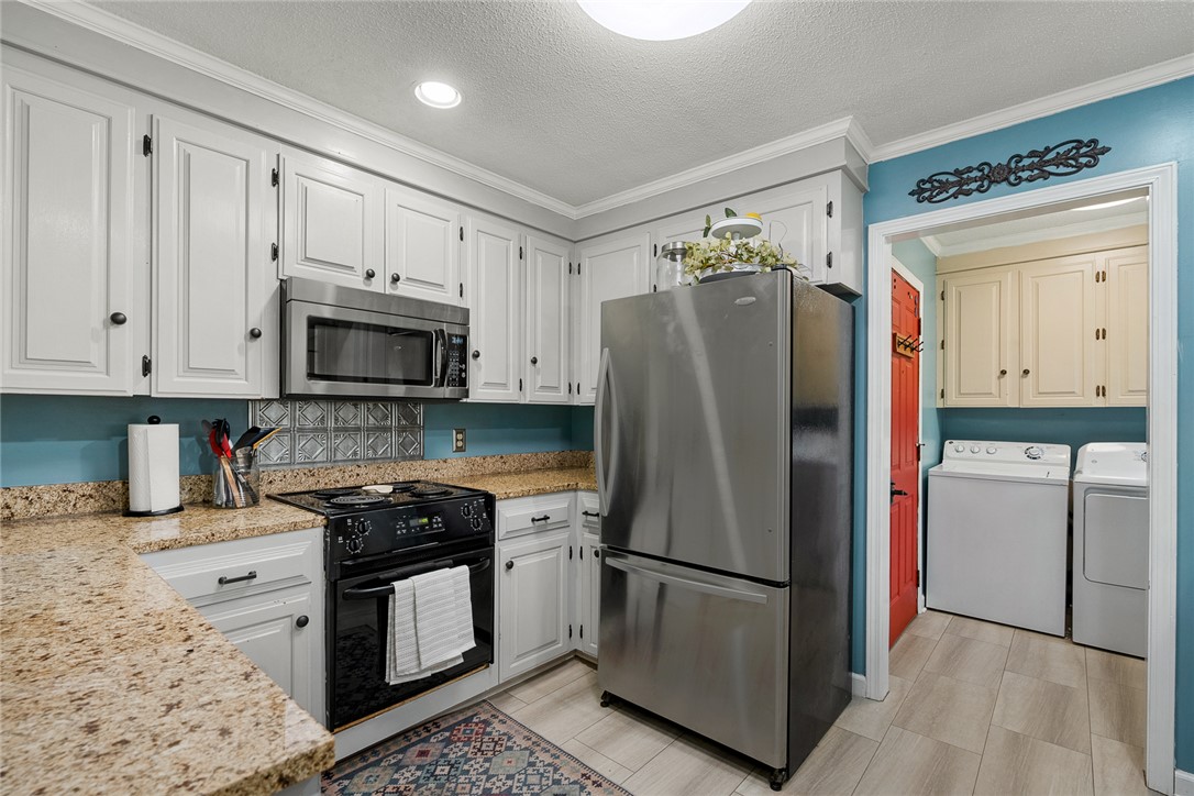 1403 Hanover Road Anderson, SC 29621 - Photo 11 of 40 This functional kitchen features granite counters, stainless steel appliances, and convenient laundry access.