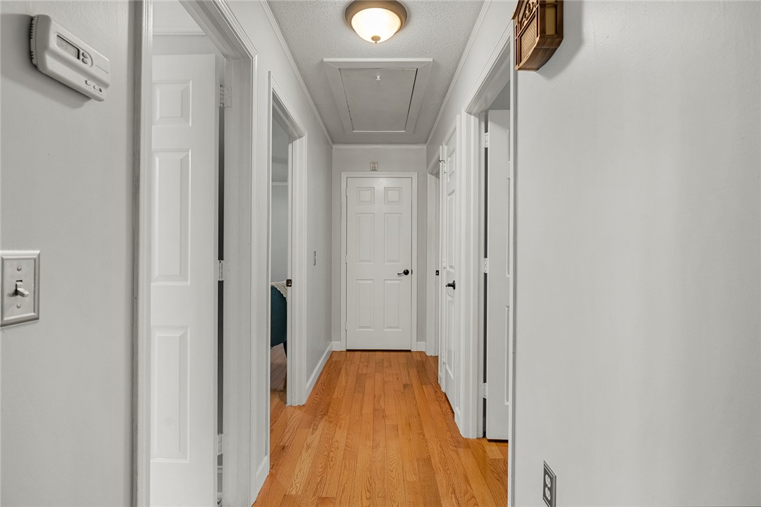 1403 Hanover Road Anderson, SC 29621 - Photo 16 of 40 This inviting hallway features warm hardwood floors and offers access to various rooms within the home.