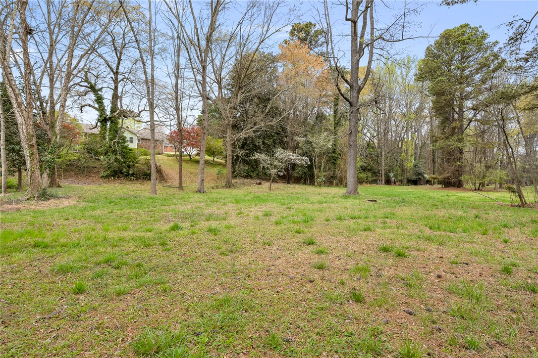 1403 Hanover Road Anderson, SC 29621 - Photo 34 of 40 Expansive green yard with mature trees offers a serene natural setting.