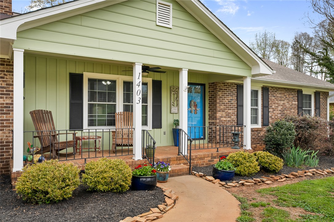 1403 Hanover Road Anderson, SC 29621 - Photo 4 of 40 A charming exterior with a welcoming porch and meticulously maintained landscaping beckons.