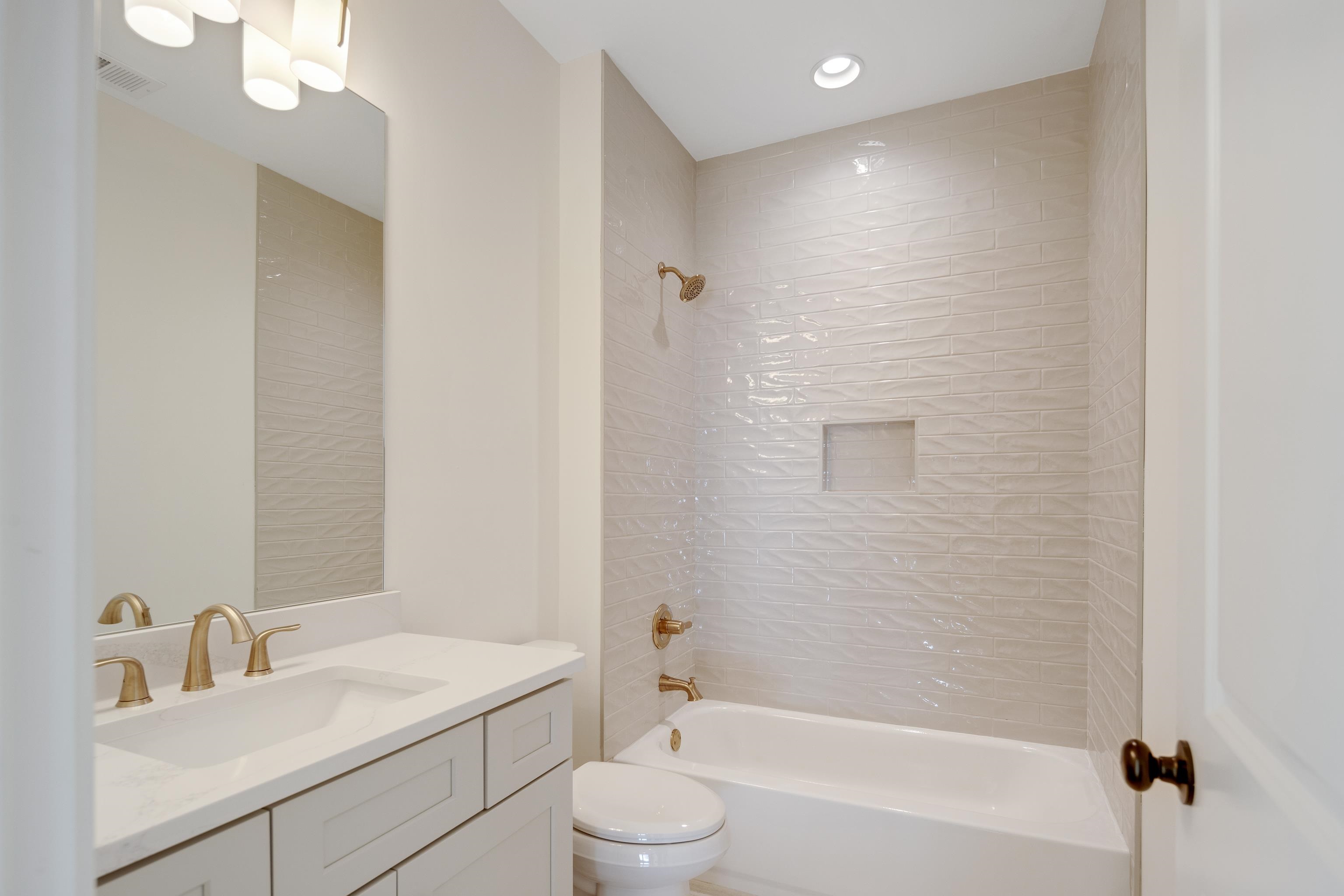 10145 Nighthawk Cove Collierville, TN 38017 - Photo 19 of 25 a bathroom with a sink a toilet and shower