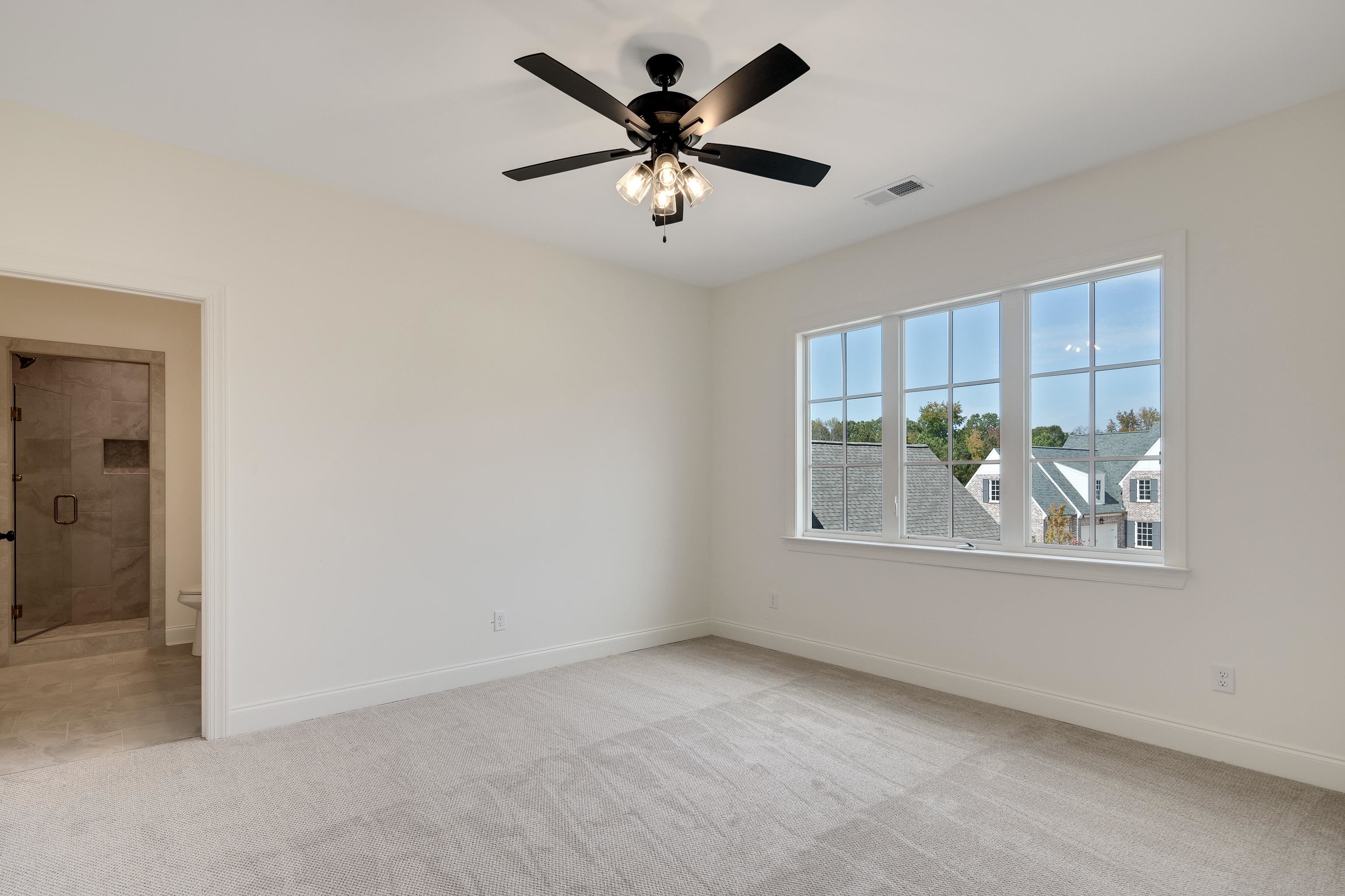10145 Nighthawk Cove Collierville, TN 38017 - Photo 20 of 25 an empty room with windows and ceiling fan