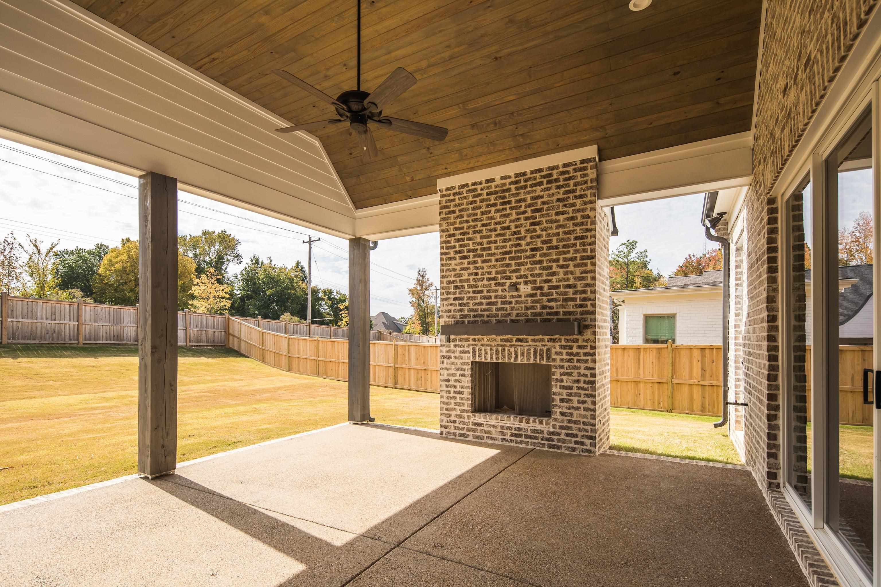 10145 Nighthawk Cove Collierville, TN 38017 - Photo 22 of 25 a view of an empty room with a fireplace and a window