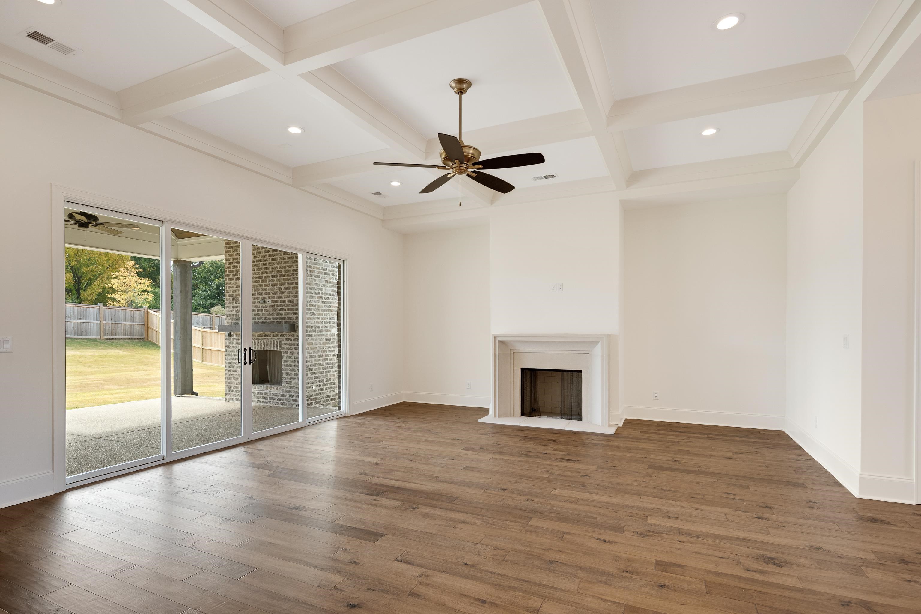 10145 Nighthawk Cove Collierville, TN 38017 - Photo 3 of 25 a view of an empty room with a fireplace and a window