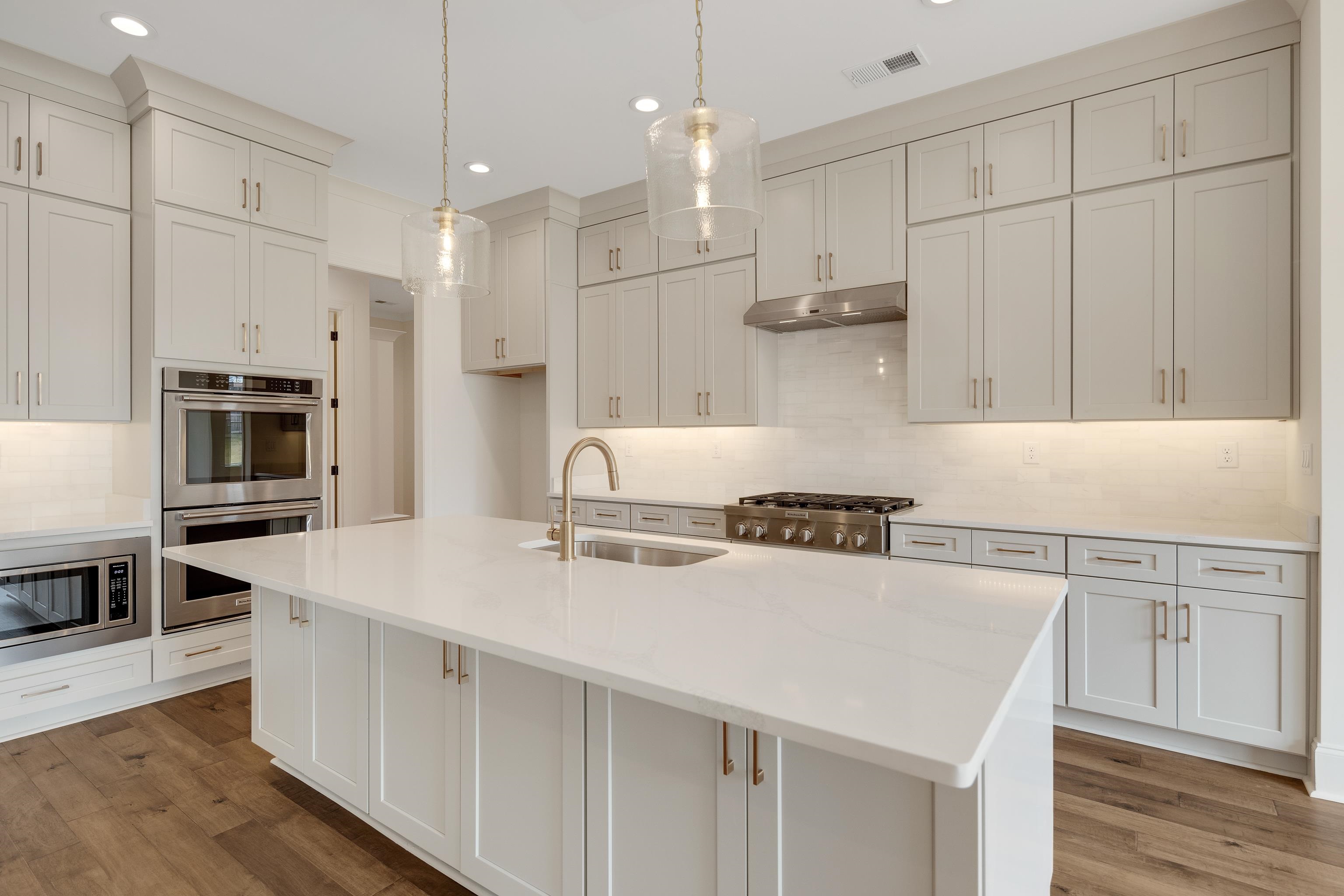 10145 Nighthawk Cove Collierville, TN 38017 - Photo 6 of 25 a kitchen with stainless steel appliances granite countertop a sink stove and refrigerator