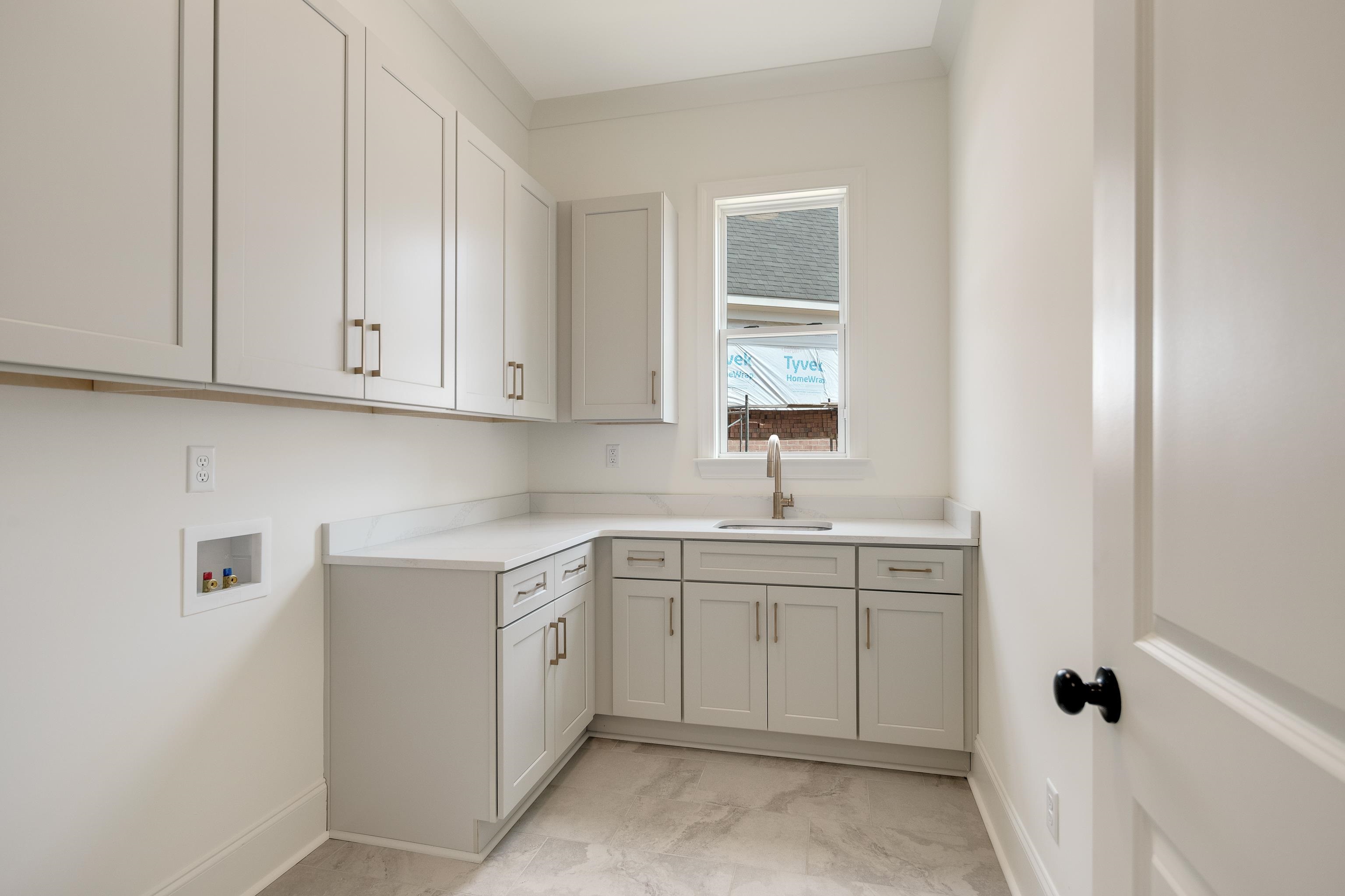 10145 Nighthawk Cove Collierville, TN 38017 - Photo 10 of 25 a view of a kitchen with white cabinets
