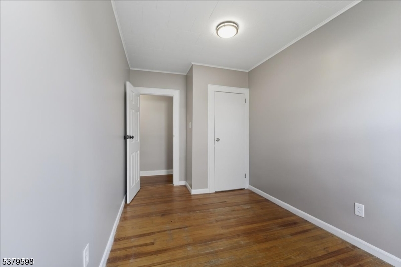 102 Exton Avenue, Unit 1 North Arlington, NJ 07031 - Photo 10 of 18 a view of a room with wooden floor