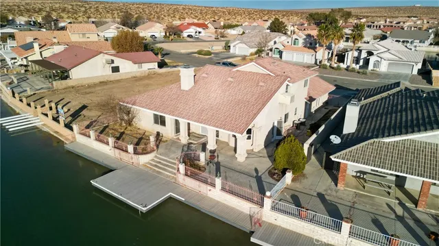 an aerial view of a house with outdoor space