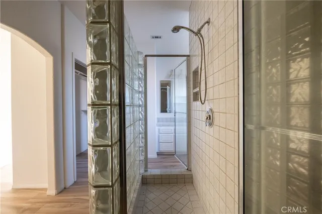 a view of a bathroom from a hallway