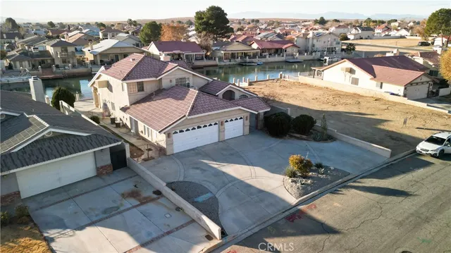 an aerial view of a house with outdoor space