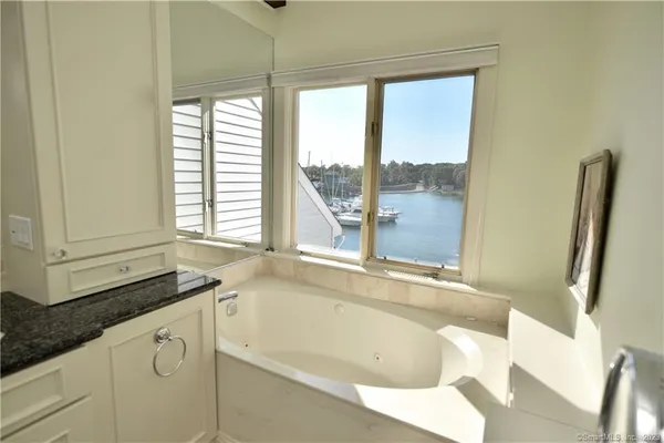 a bath tub sitting next to a window