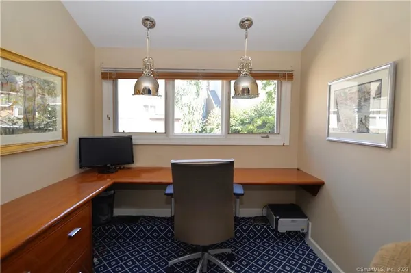 a workspace with furniture and window