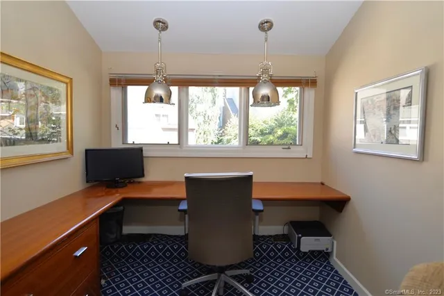 a workspace with furniture and window