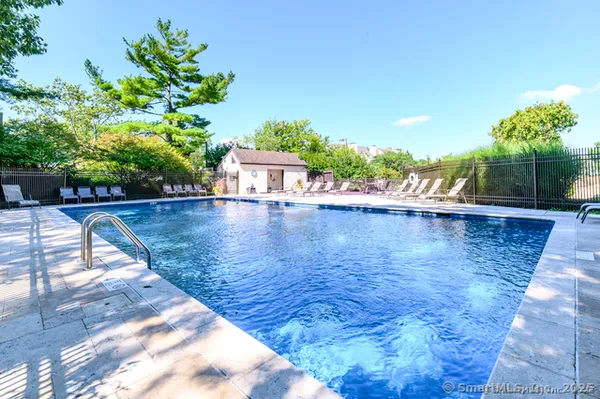 a view of a swimming pool with a patio