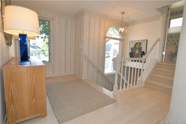 workspace with wooden floor windows and stairs