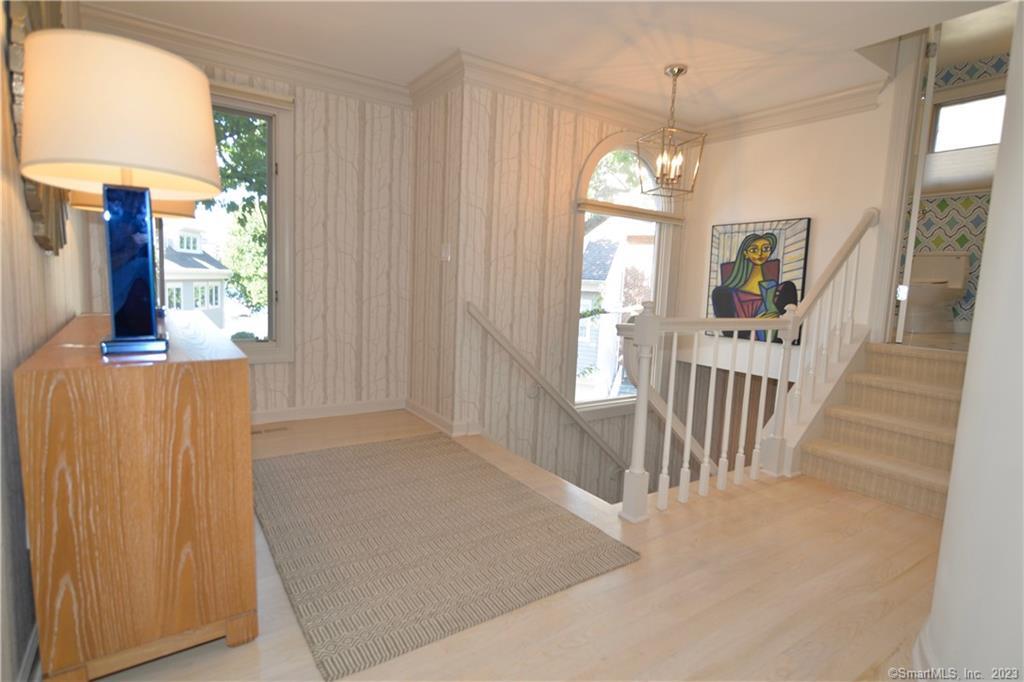 123 Harbor Drive, Unit 512 Stamford, CT 06902 - Photo 4 of 24 workspace with wooden floor windows and stairs