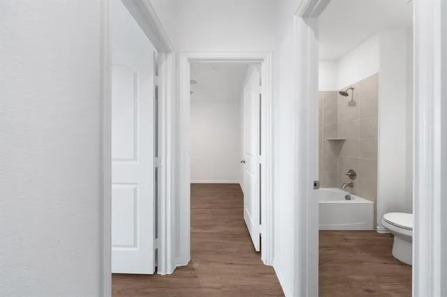 a view of a bathroom from a hallway