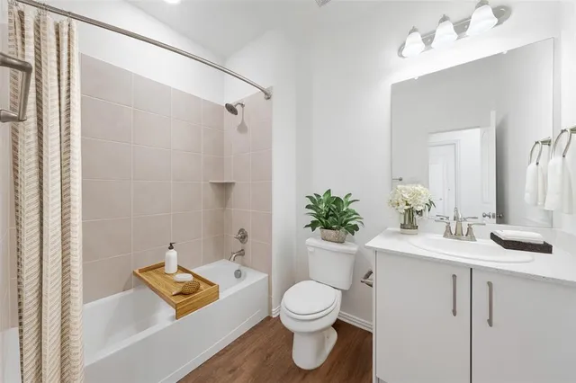 a bathroom with a toilet sink and a mirror