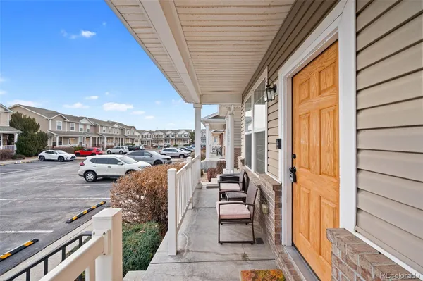 a view of a balcony with furniture