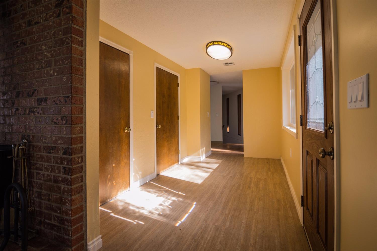 3770 Old Stage Road Central Point, OR 97502 - Photo 14 of 29 a view of a hallway with wooden floor and a bathroom