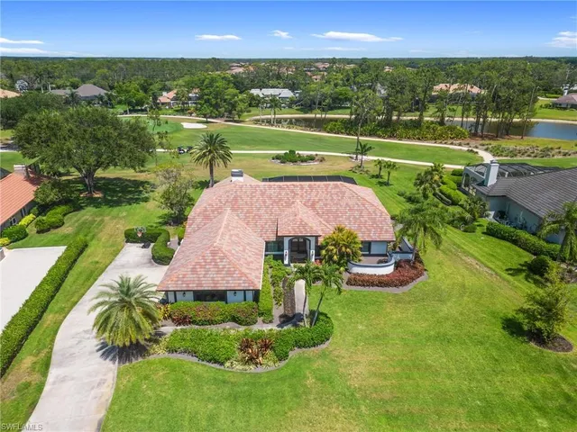 an aerial view of a house with yard swimming pool and outdoor seating