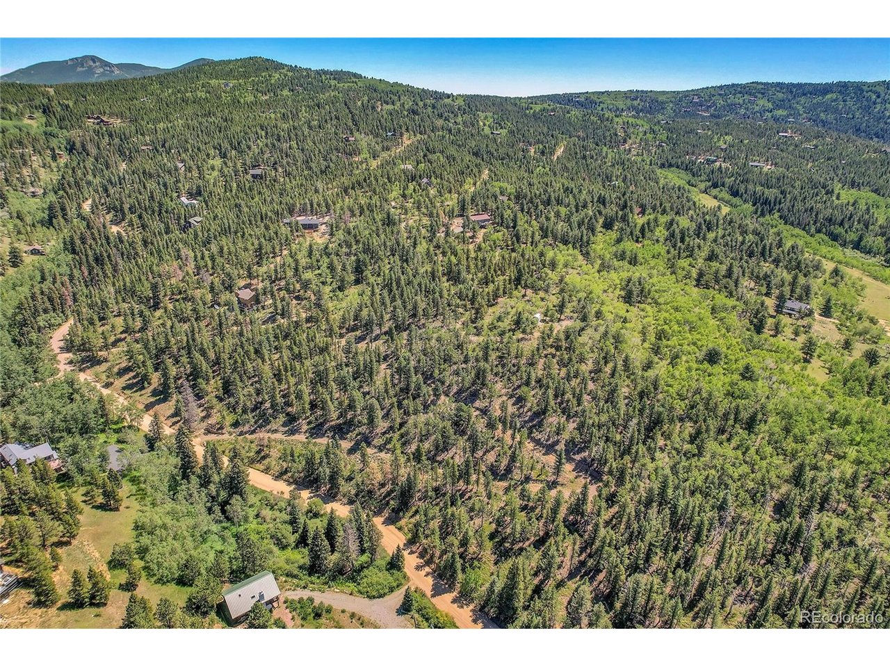 9 Hughesville Road Black Hawk, CO 80422 - Photo 1 of 17 a view of a field with an ocean