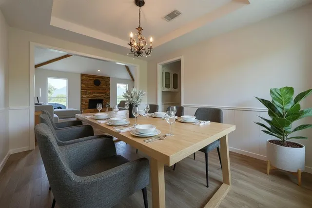 a view of a dining room with furniture window and wooden floor