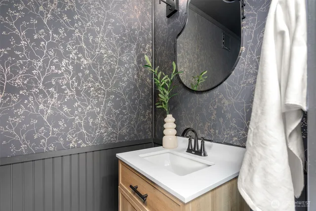 a bathroom with a sink and a mirror