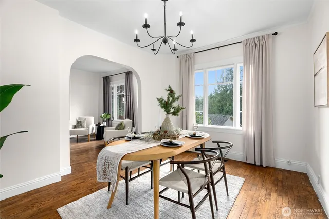 a view of a dining room with furniture window and wooden floor