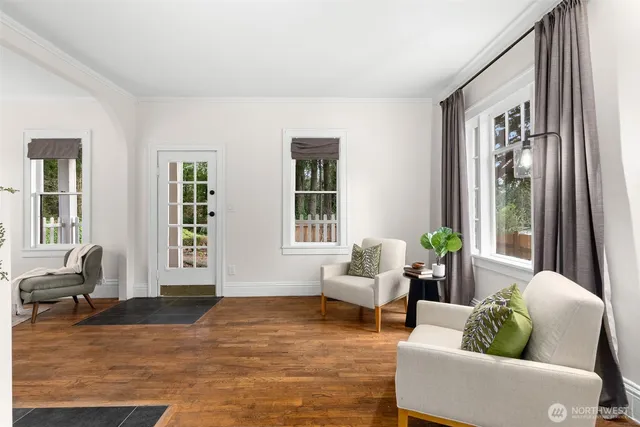 a living room with furniture and windows