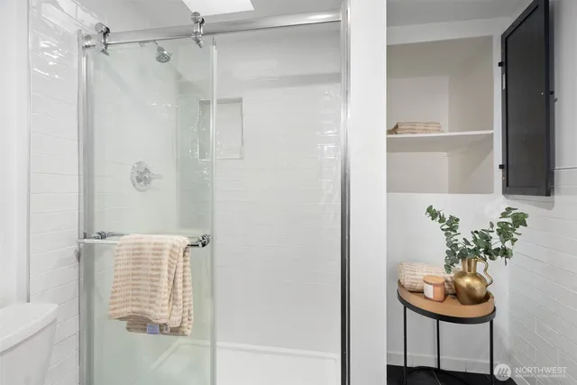 a bathroom with a tub and shower