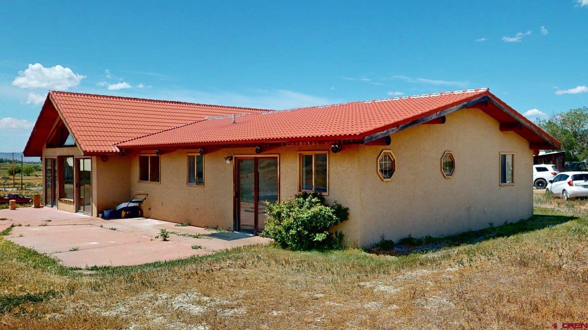 40557 M75 Road Paonia, CO 81428 - Photo 29 of 34 a backyard of a house with yard and outdoor seating