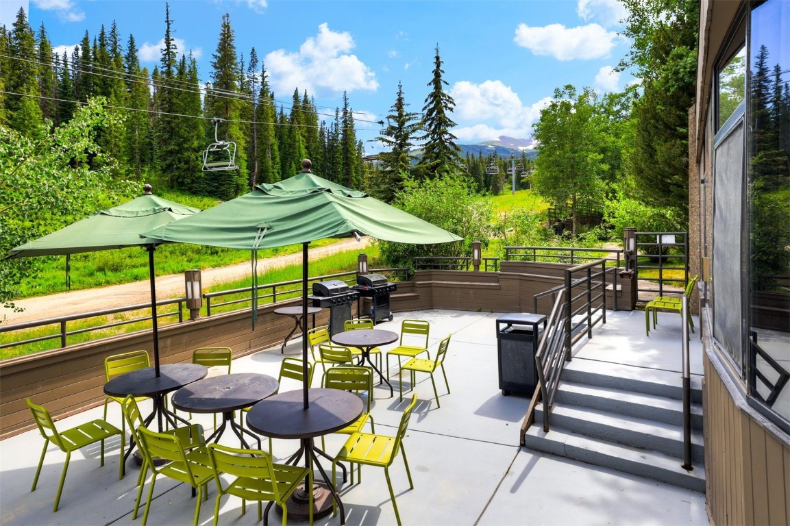 601 Village Road, Unit 503 Breckenridge, CO 80424 - Photo 31 of 48 a view of an chairs and tables in the patio