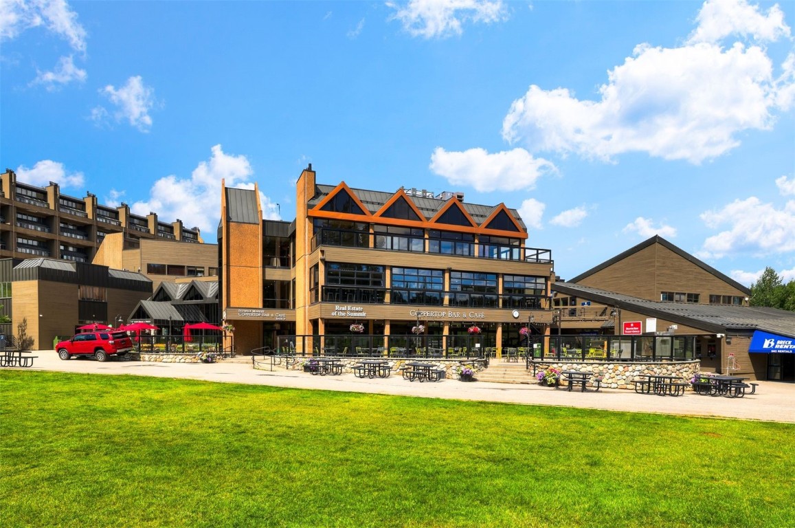 601 Village Road, Unit 503 Breckenridge, CO 80424 - Photo 40 of 48 a front view of building with yard and swimming pool
