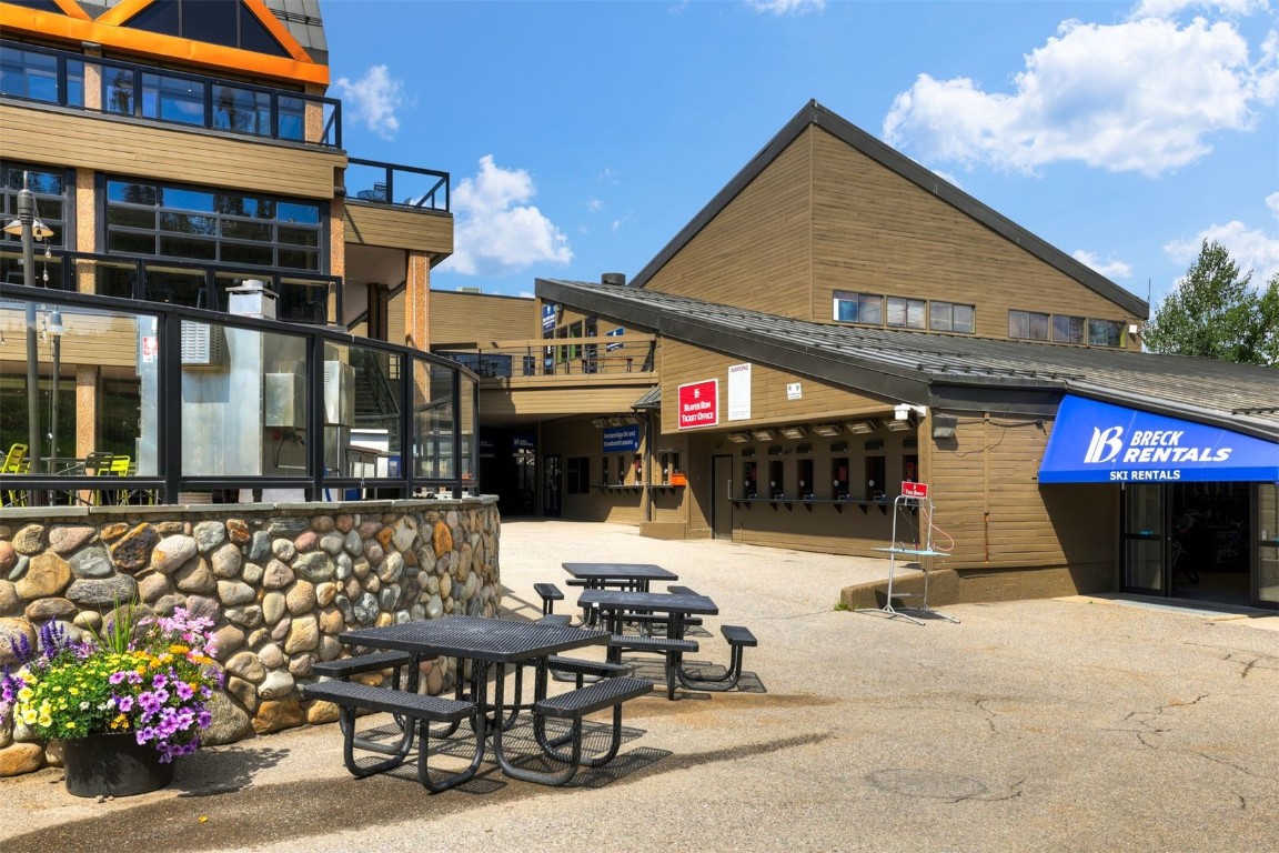601 Village Road, Unit 503 Breckenridge, CO 80424 - Photo 44 of 48 a view of a patio with table and chairs potted plants