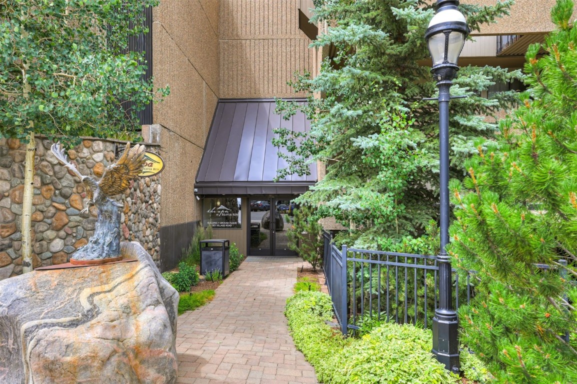 601 Village Road, Unit 503 Breckenridge, CO 80424 - Photo 46 of 48 a front view of a house with a yard