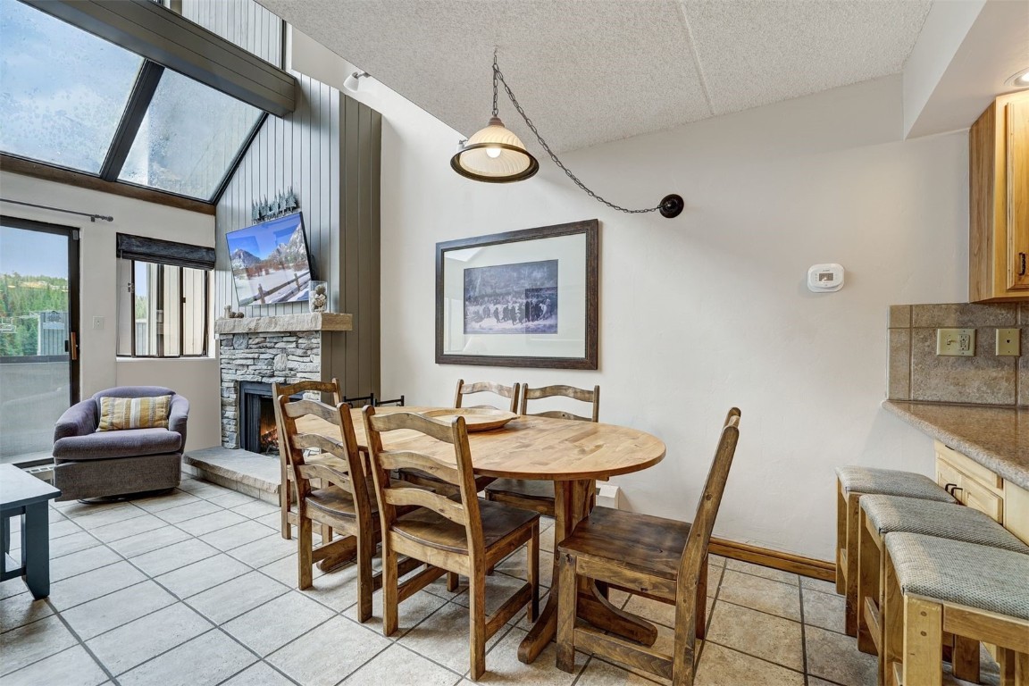 601 Village Road, Unit 503 Breckenridge, CO 80424 - Photo 6 of 48 a dining room with furniture and window